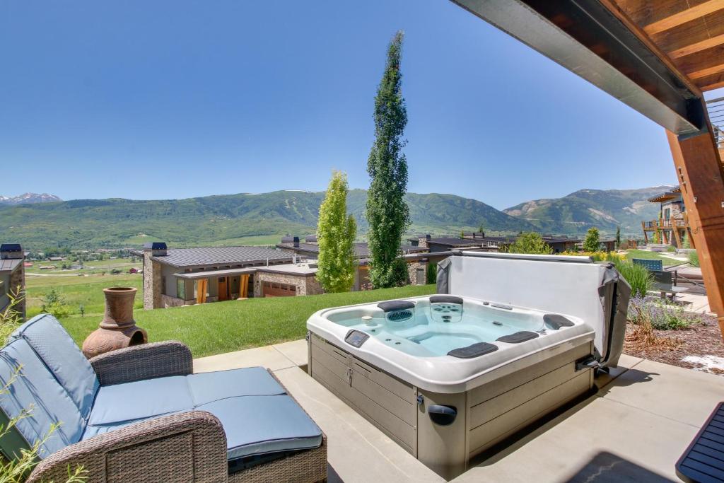 a hot tub on the patio of a house at Powder Mountain Home with Private Hot Tub and Views! in Eden