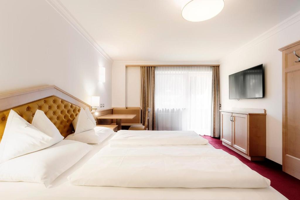 Postel nebo postele na pokoji v ubytování Hotel Ingram