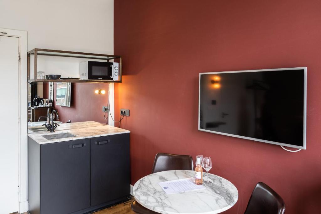 Kuchyň nebo kuchyňský kout v ubytování Weber Hotel 397