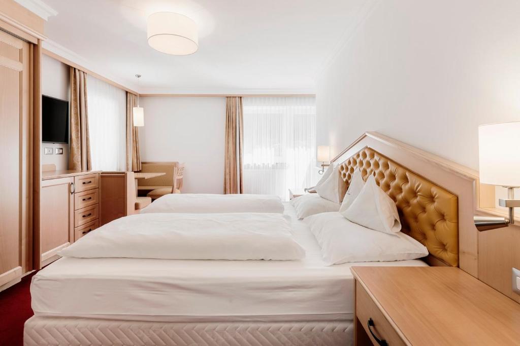 Postel nebo postele na pokoji v ubytování Hotel Ingram