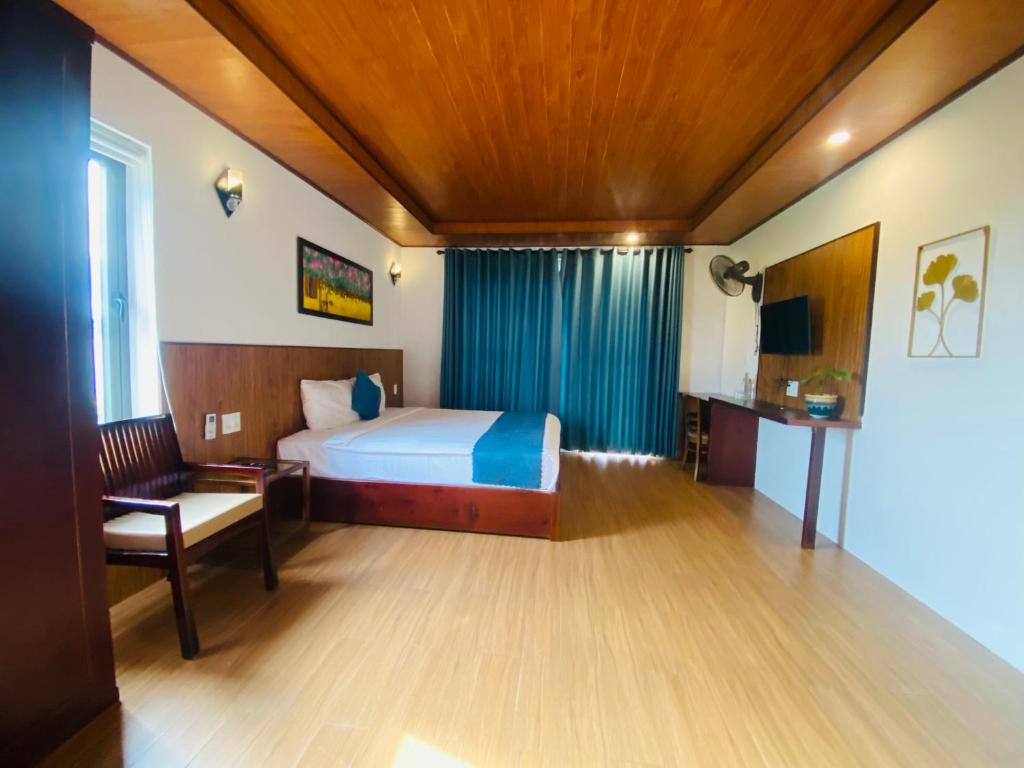 Postel nebo postele na pokoji v ubytování SenDa Villa & Apartment Hoi An