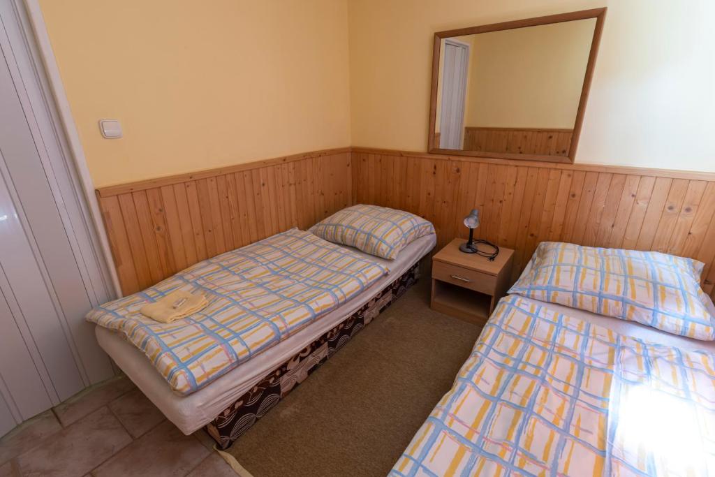 Postel nebo postele na pokoji v ubytování Drevenice Via Vitis