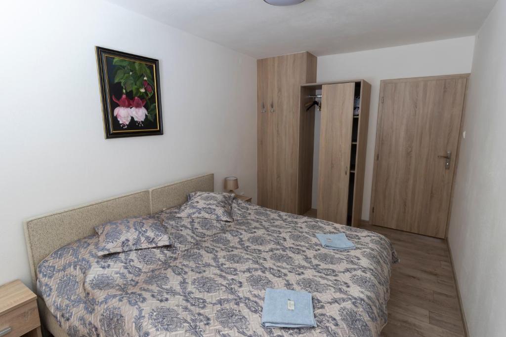 Postel nebo postele na pokoji v ubytování Rezort Via Vitis