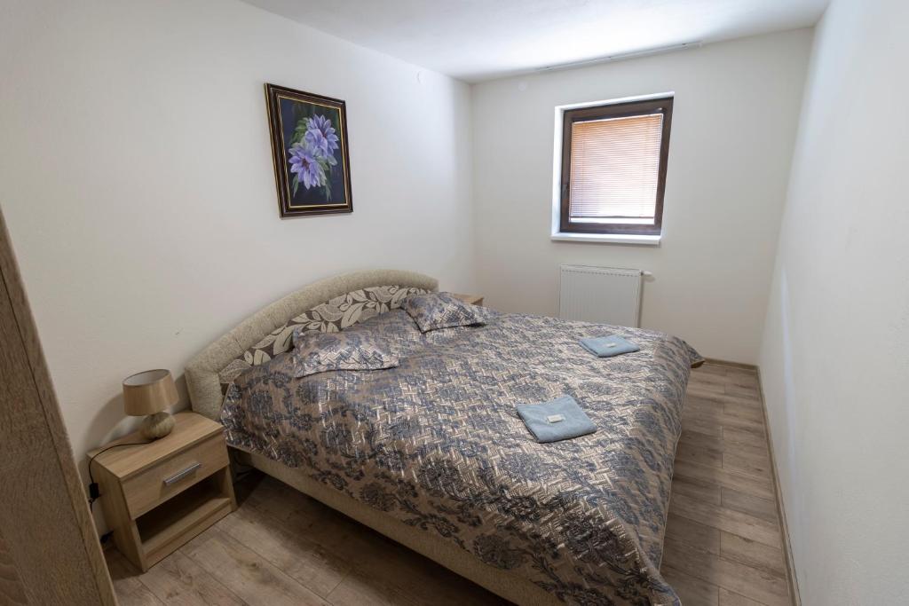 Postel nebo postele na pokoji v ubytování Rezort Via Vitis