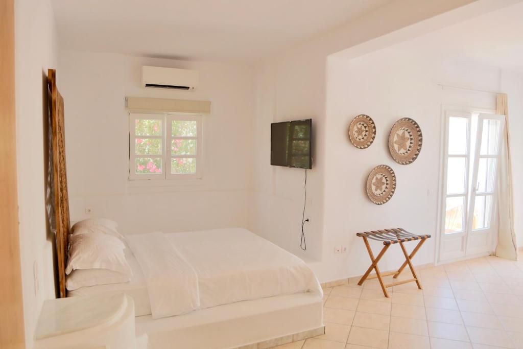 Postel nebo postele na pokoji v ubytování Ubud Mykonos