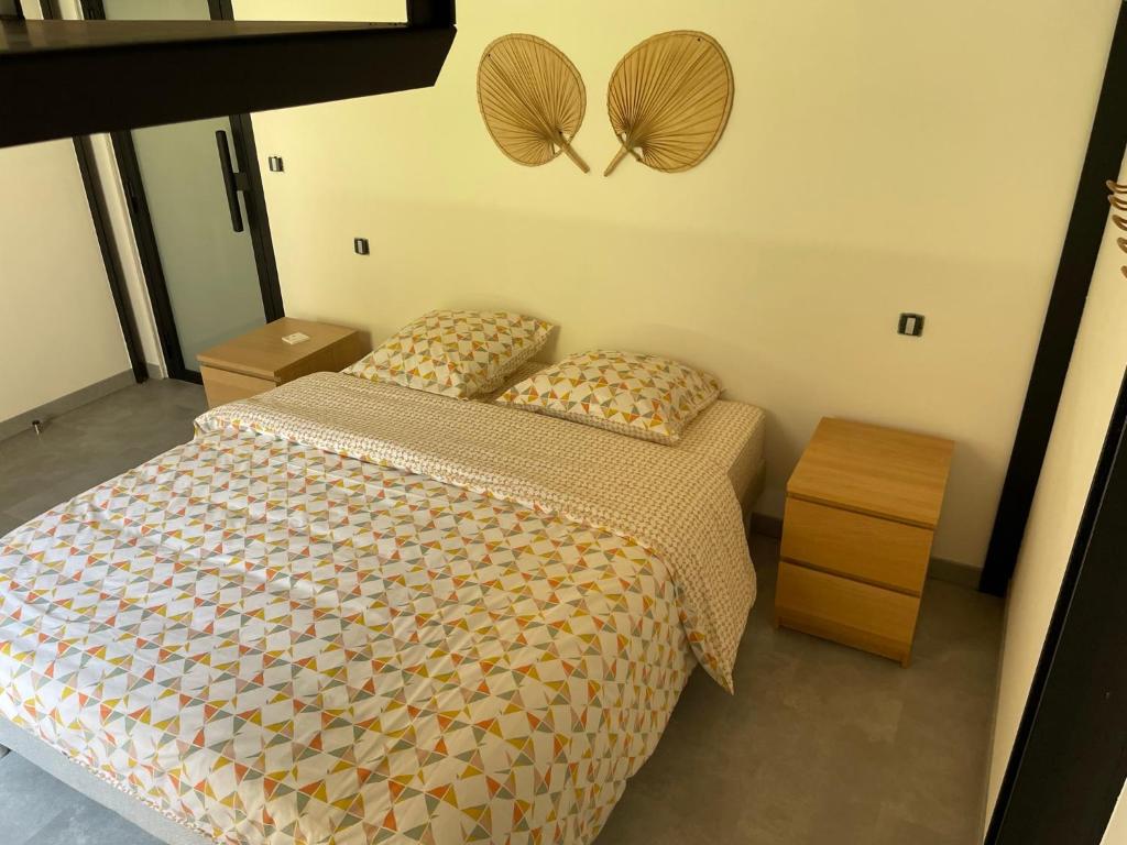 Postel nebo postele na pokoji v ubytování Le Corail