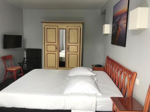 Postel nebo postele na pokoji v ubytování Hôtel Ohartzia