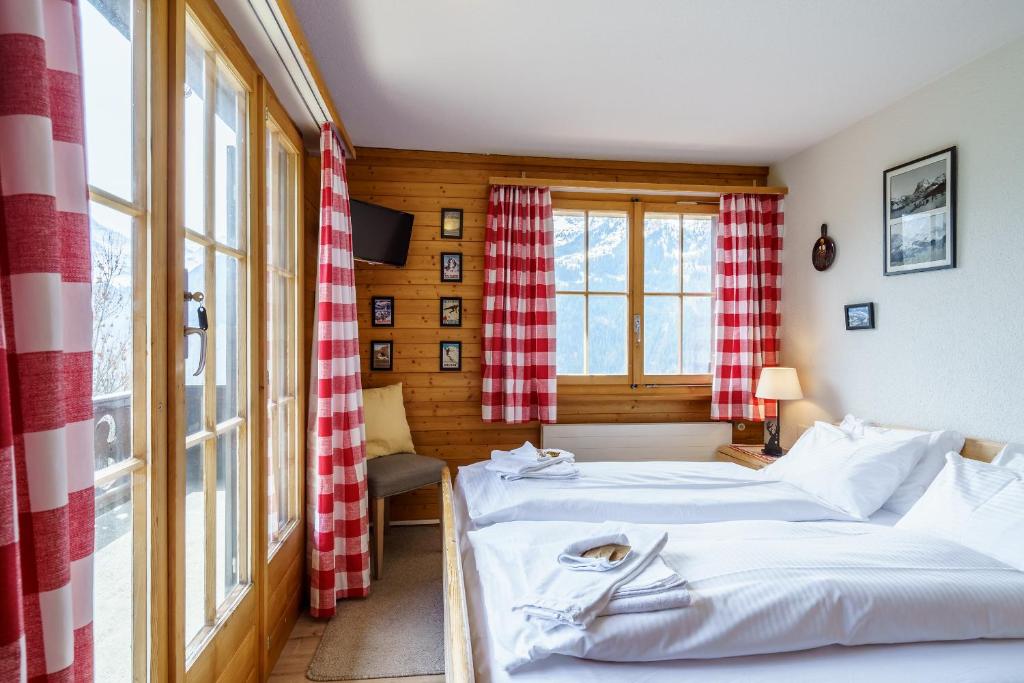 Postel nebo postele na pokoji v ubytování Chalet Bergkristall