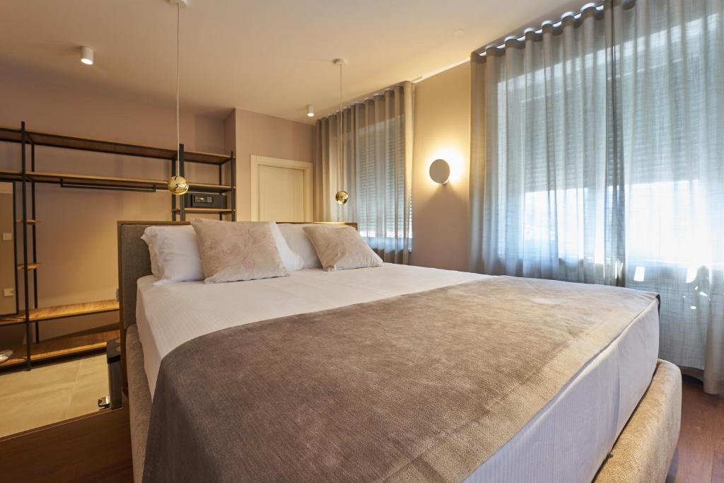 Postel nebo postele na pokoji v ubytování Dolcemente Garni Hotel Superior