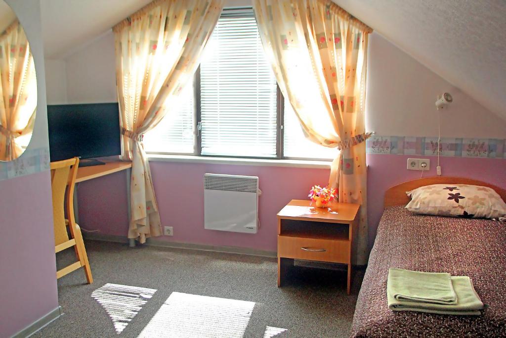 Postel nebo postele na pokoji v ubytování Rivaal Guesthouse-Cafe