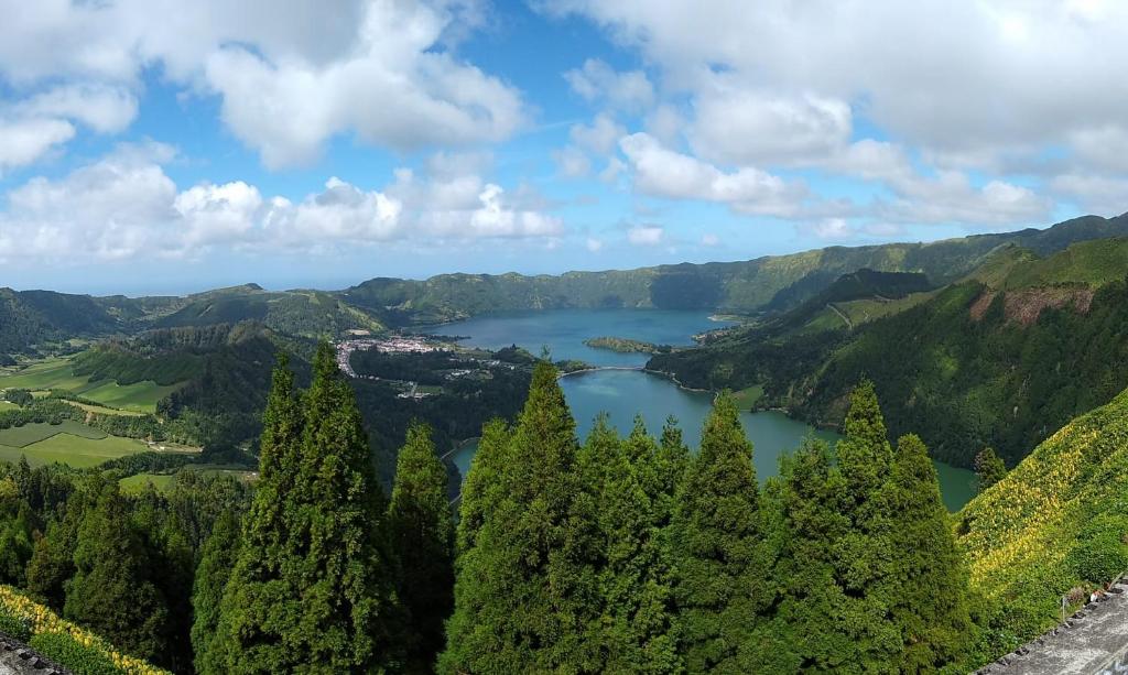 a view of a lake in the mountains at Pousada da Vila in Vila Franca do Campo