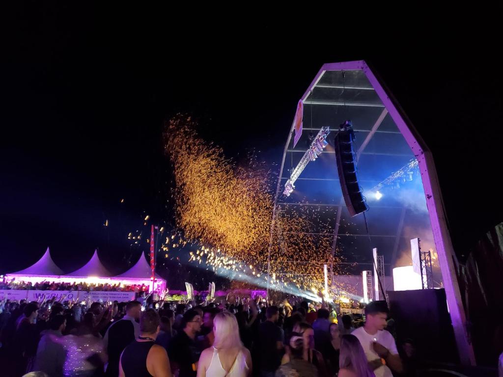a crowd of people at a concert at night at Pousada da Vila in Vila Franca do Campo