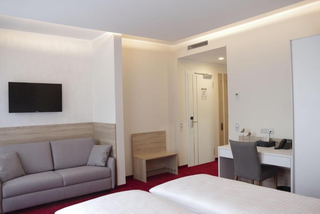 Postel nebo postele na pokoji v ubytování Hotel am Waldkasino