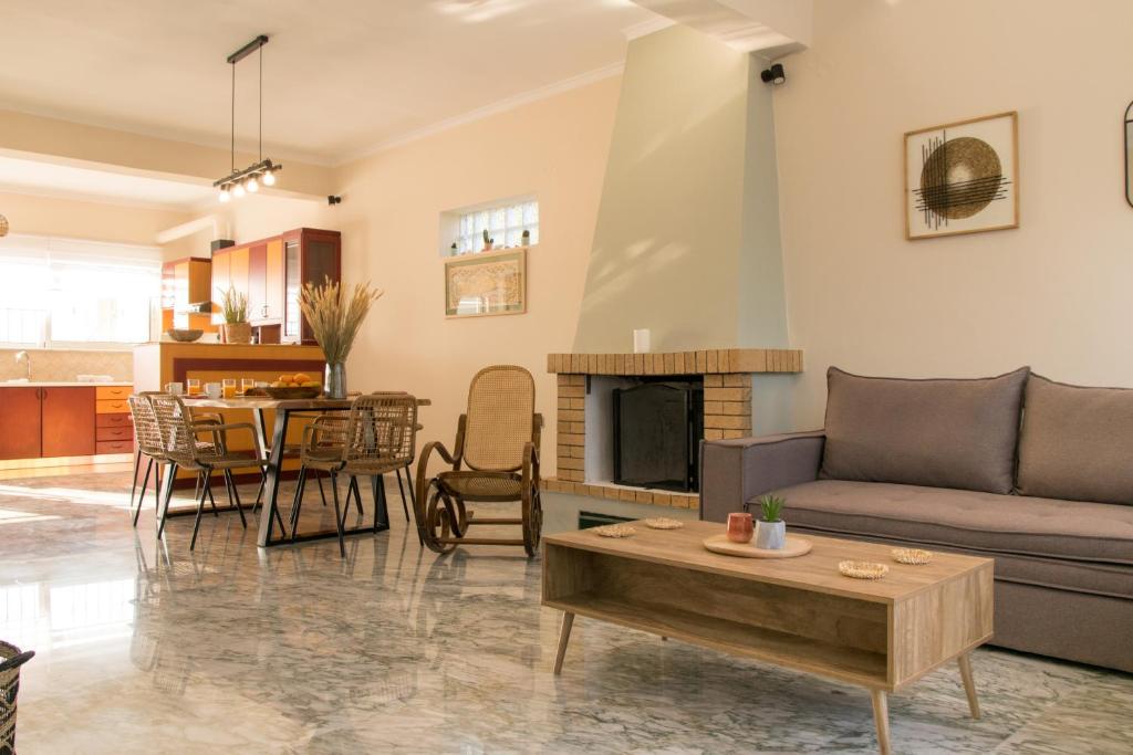 a living room with a couch and a table at Searenity Home in Ropanianá