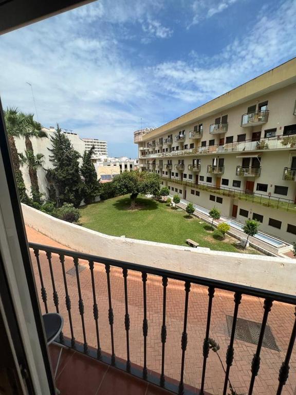 a view from a balcony of a building at Apartamentos COZYNNS II in Torremolinos