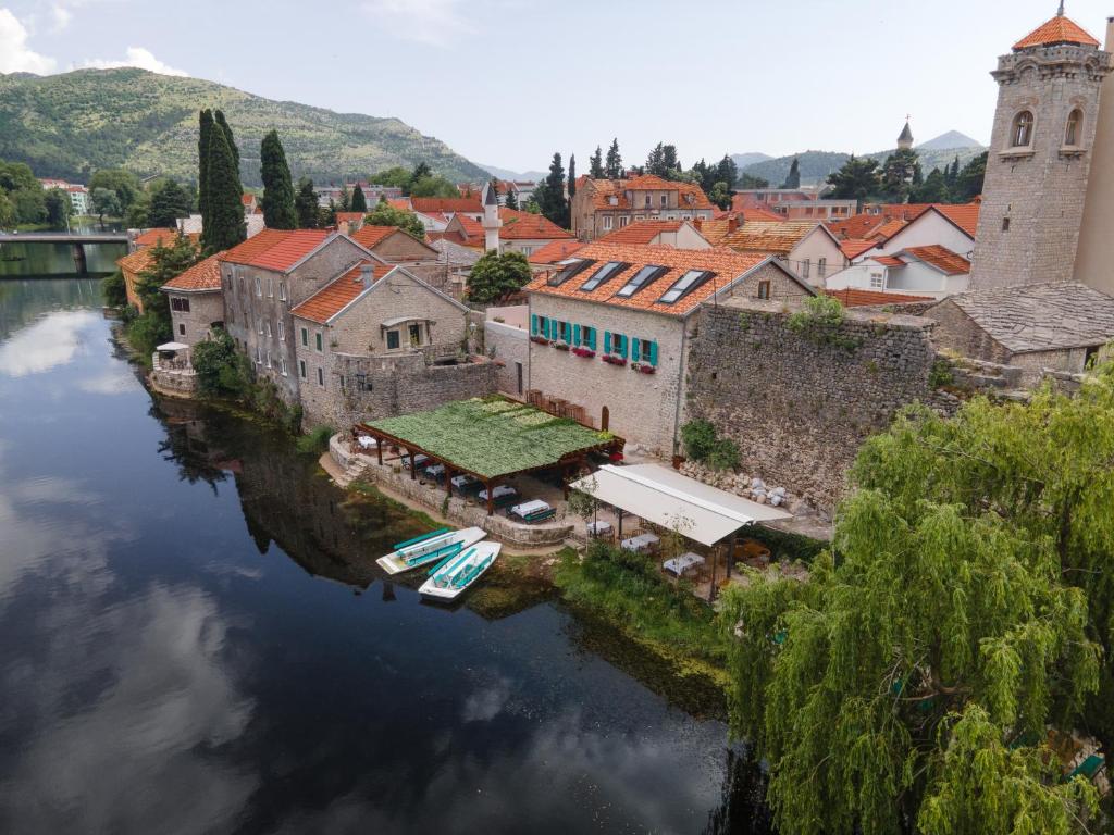 an aerial view of a town on a river at Hotel Restoran Humsko in Trebinje