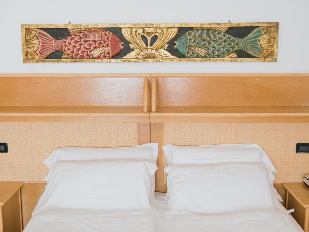Postel nebo postele na pokoji v ubytování Hotel Bristol