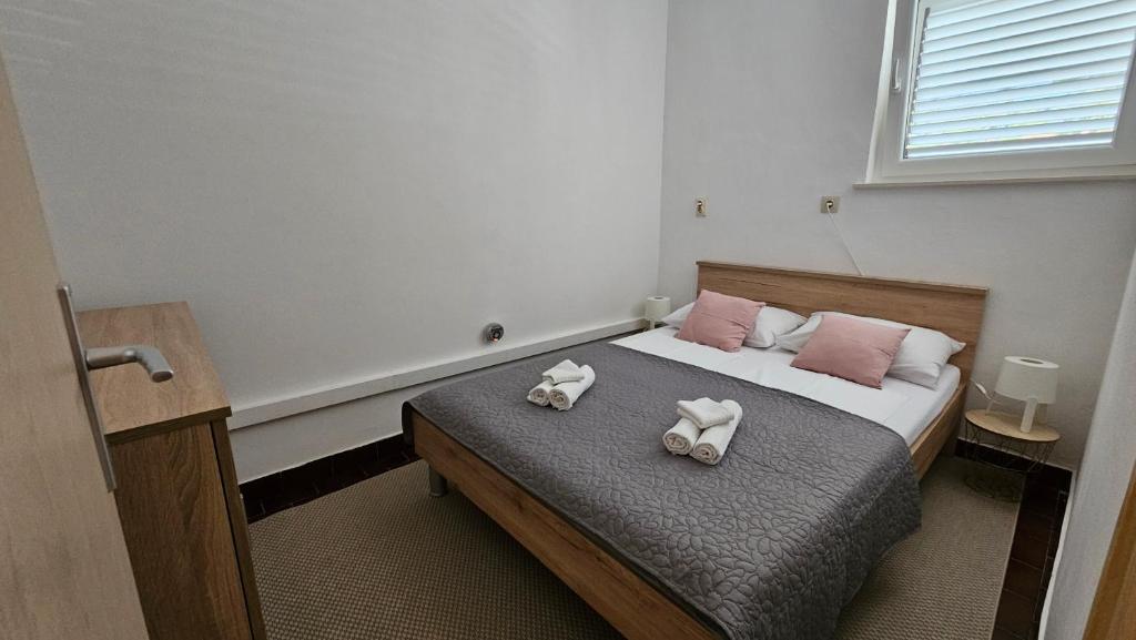 Postel nebo postele na pokoji v ubytování Apartman Hope