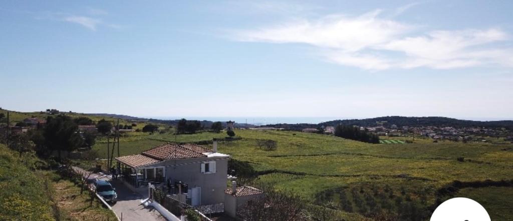 an aerial view of a house in a field at Farmhouse in Volímai