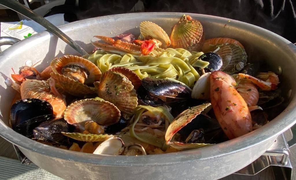 a pot of food with seafood and pasta in it at Villa Yucca Istra in Labin