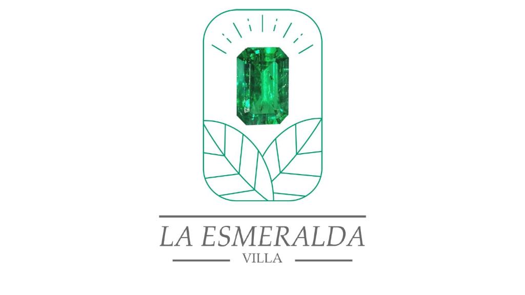 a green emerald gemstone with the text la esmeralda villa at La Esmeralda Villa in Orotina