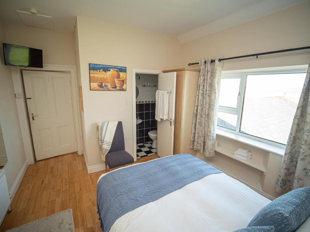 Postel nebo postele na pokoji v ubytování Ceol na Mara Guest House