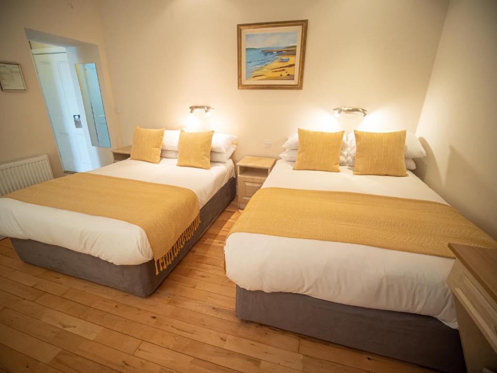 Postel nebo postele na pokoji v ubytování Ceol na Mara Guest House