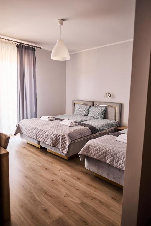 Postel nebo postele na pokoji v ubytování Villa Lima