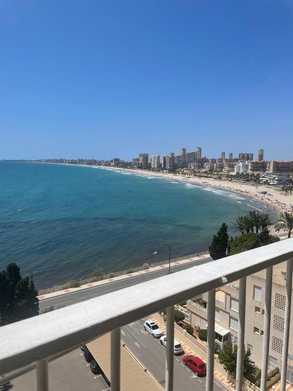 a view of the beach from a balcony at Tahiti Dreams in El Campello