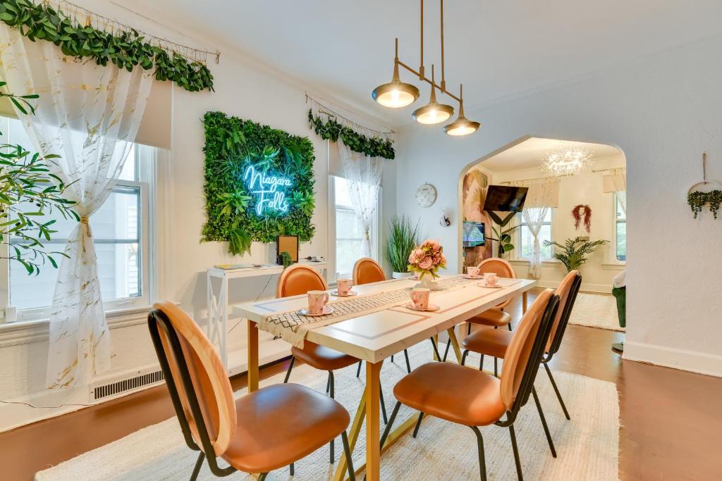 a dining room with a table and chairs at Themed New York Home about 2 Mi to Niagara Falls! in Niagara Falls