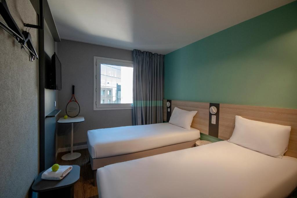 Postel nebo postele na pokoji v ubytování ibis budget Nice Aeroport