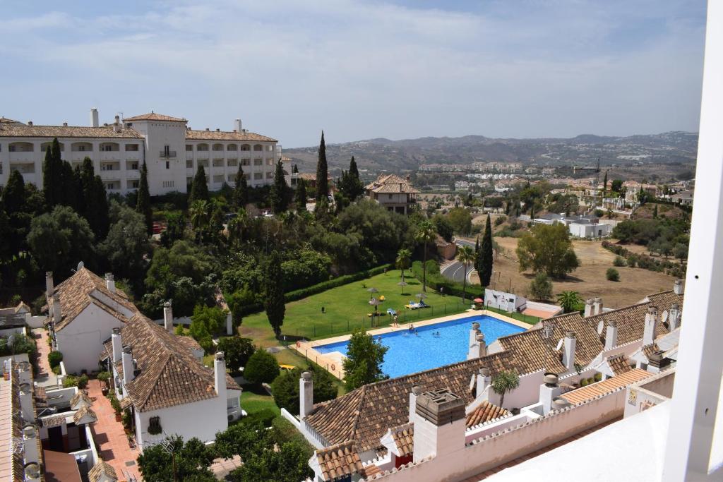 an aerial view of a resort with a swimming pool at Duplex con vistas mijas Golf in Mijas