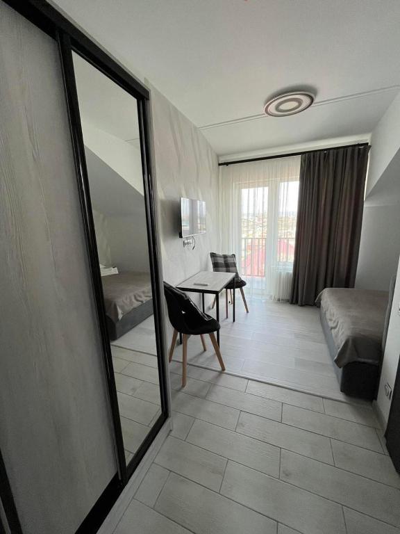 Postel nebo postele na pokoji v ubytování Forsage Hotel