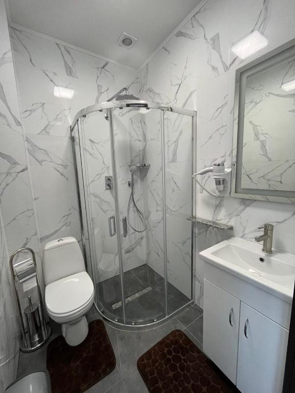 Koupelna v ubytování Forsage Hotel