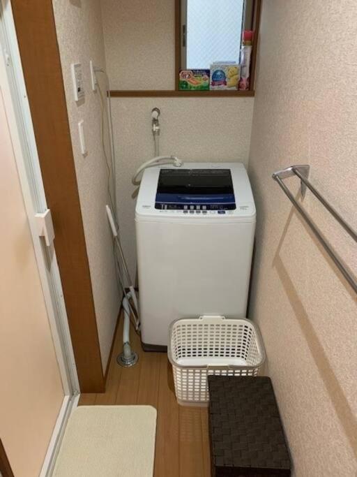 Postel nebo postele na pokoji v ubytování 江ノ島HOME