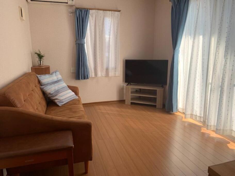 TV a/nebo společenská místnost v ubytování 江ノ島HOME