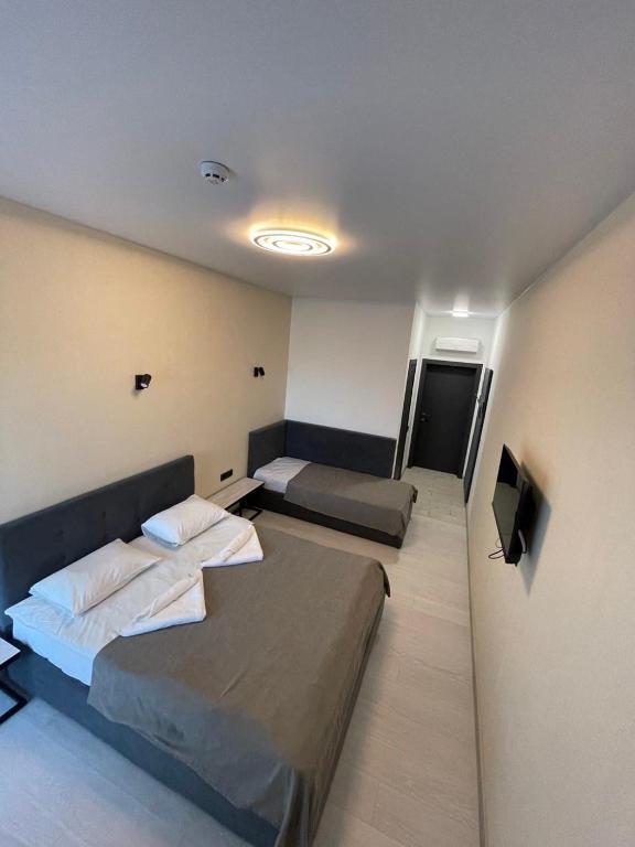 Postel nebo postele na pokoji v ubytování Forsage Hotel