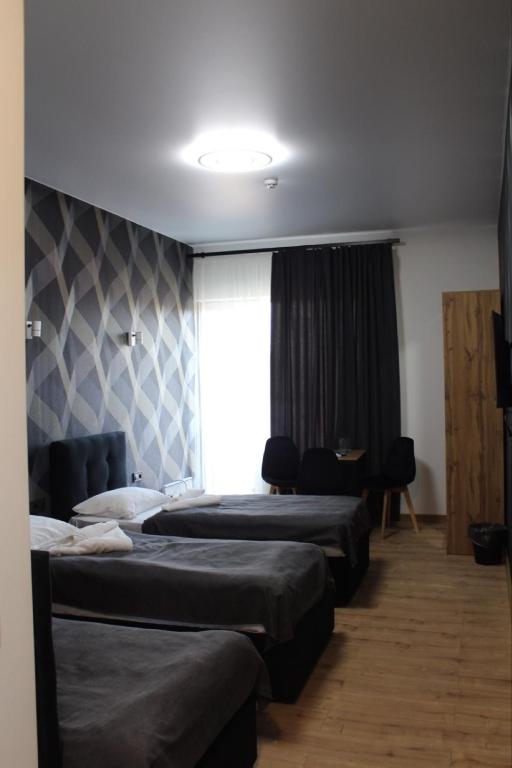 Postel nebo postele na pokoji v ubytování Forsage Hotel