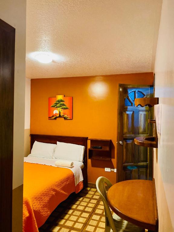 Postel nebo postele na pokoji v ubytování Hostal Alpachaca - New Quito Airport