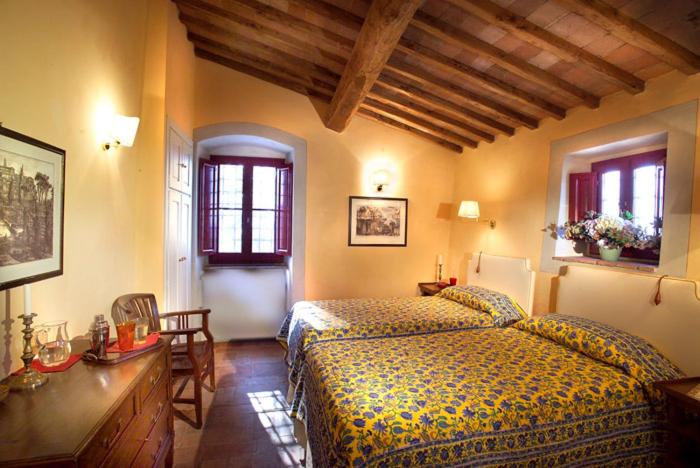 Postel nebo postele na pokoji v ubytování La Veronica Exclusive Chianti Resort