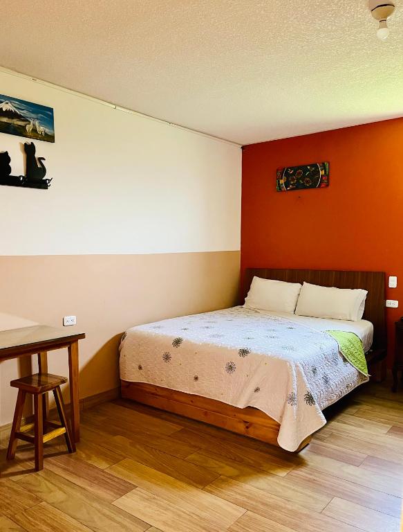 Postel nebo postele na pokoji v ubytování Hostal Alpachaca - New Quito Airport