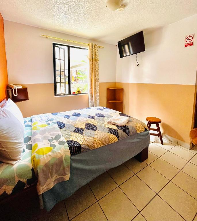 Postel nebo postele na pokoji v ubytování Hostal Alpachaca - New Quito Airport