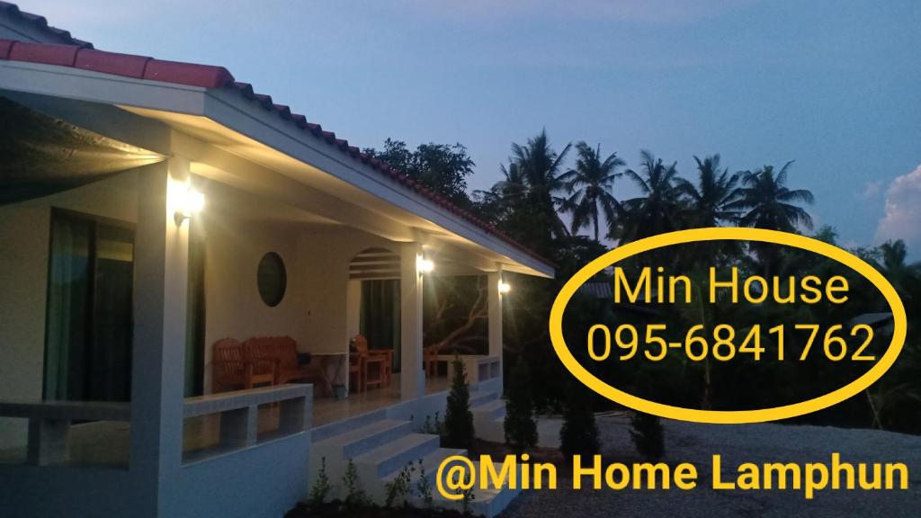 a house with a sign that reads min house at Min House in Lamphun