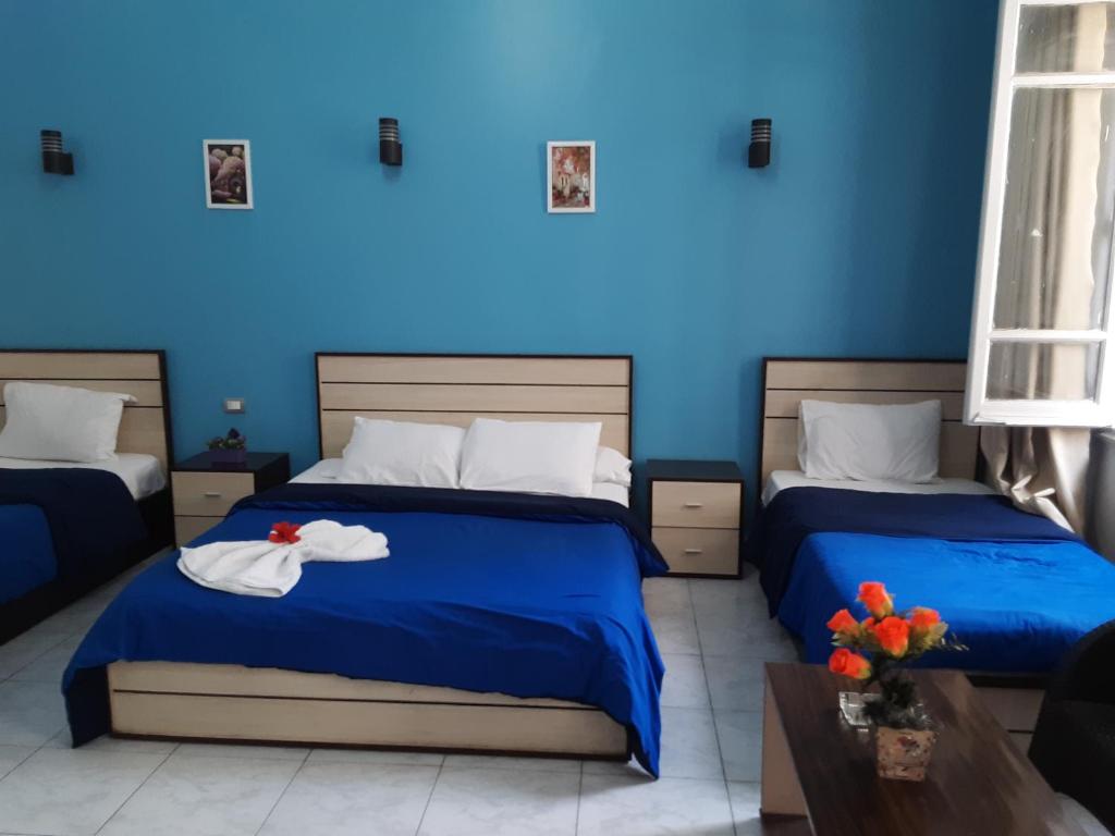 Postel nebo postele na pokoji v ubytování Hostgram Hotel