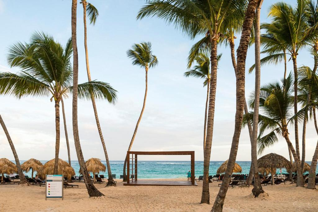 a view of the beach with palm trees at Royalton Hideaway Punta Cana, An Autograph Collection All-Inclusive Resort & Casino - Adults Only in Punta Cana