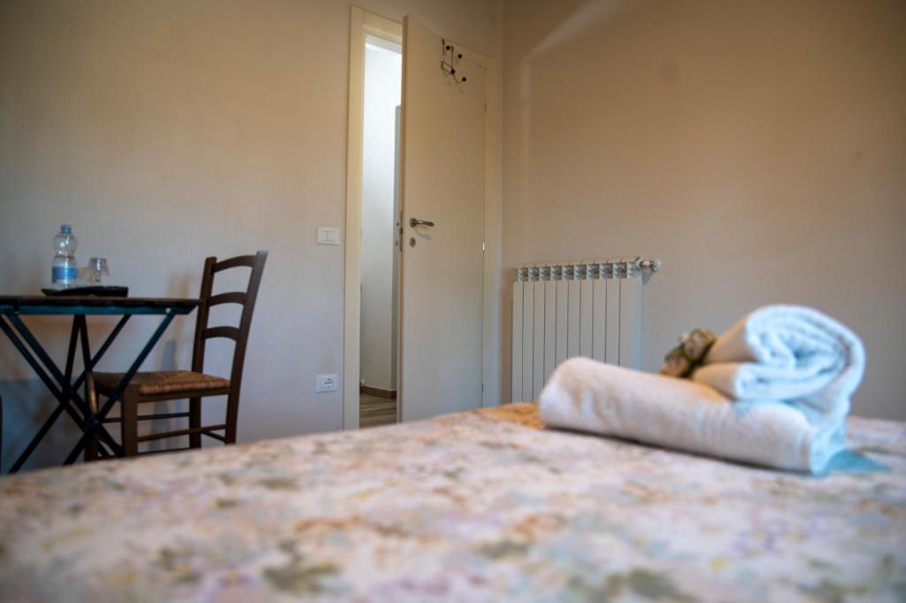 Postel nebo postele na pokoji v ubytování Corte Volpe Home