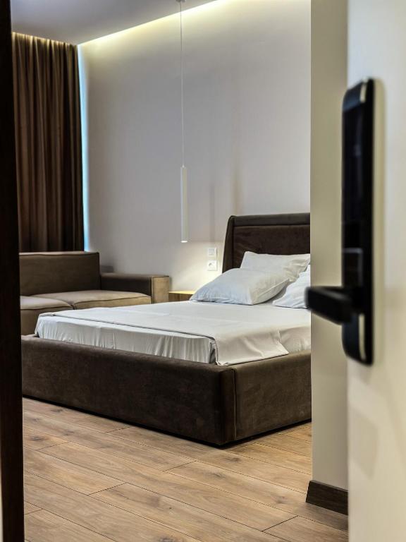 Postel nebo postele na pokoji v ubytování ALEXANDER Rooms
