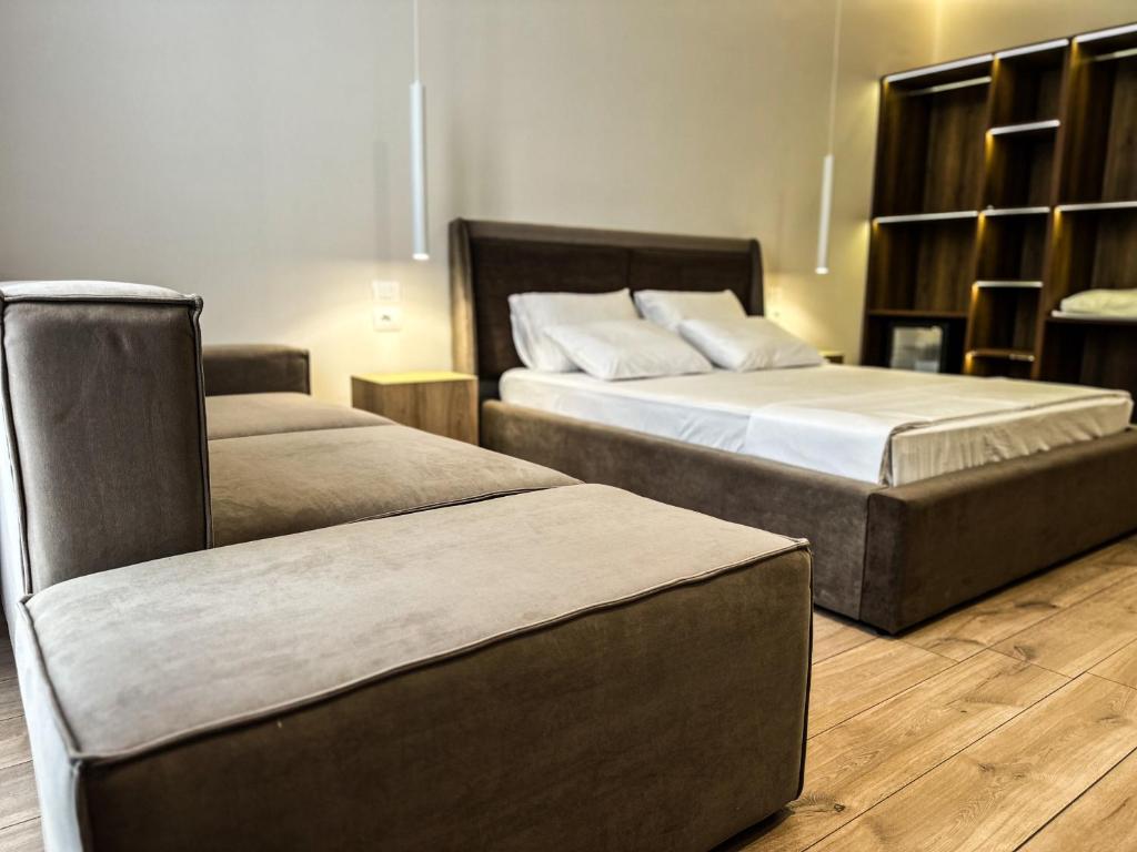 Postel nebo postele na pokoji v ubytování ALEXANDER Rooms