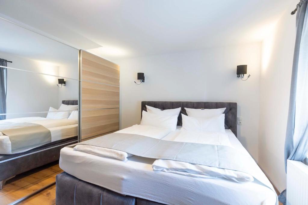 Postel nebo postele na pokoji v ubytování Hotel BUTZ