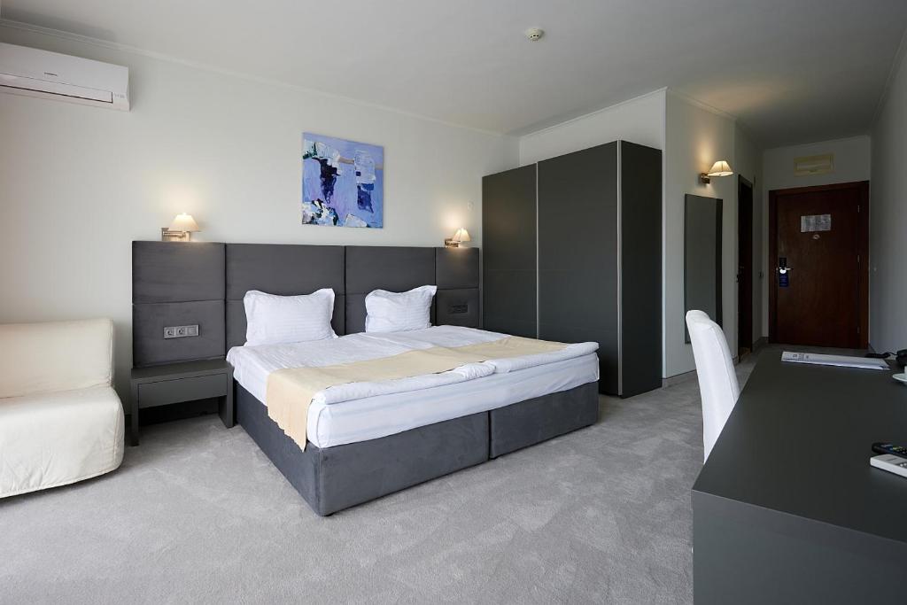 Postel nebo postele na pokoji v ubytování Hotel Continental